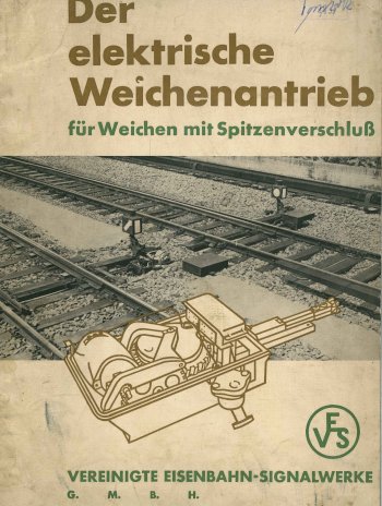 Titel, Zeichnung eines geöffneten Weichenantriebs vor einer Weiche (Foto), VES-Symbol